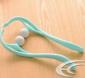 Blue manual neck massager hand roller with swan design and adjustable stand on a white background.