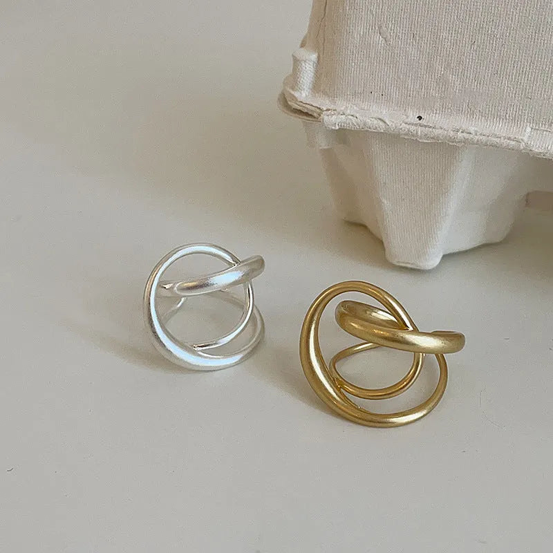 Women's matte metal open ring with three-dimensional interlaced geometric design in gold or silver finish