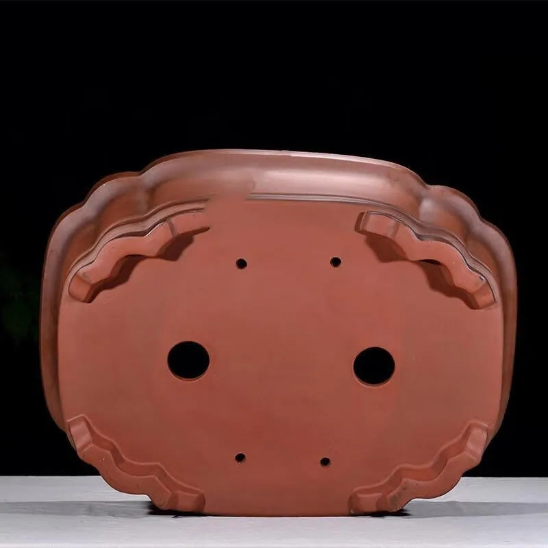 Large antique-finish Chinese purple clay flower pot with decorative tree stump and floral motifs.