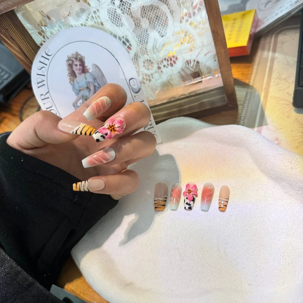 Zebra pattern Lily hand carving nail art with embossed flower designs in four sizes