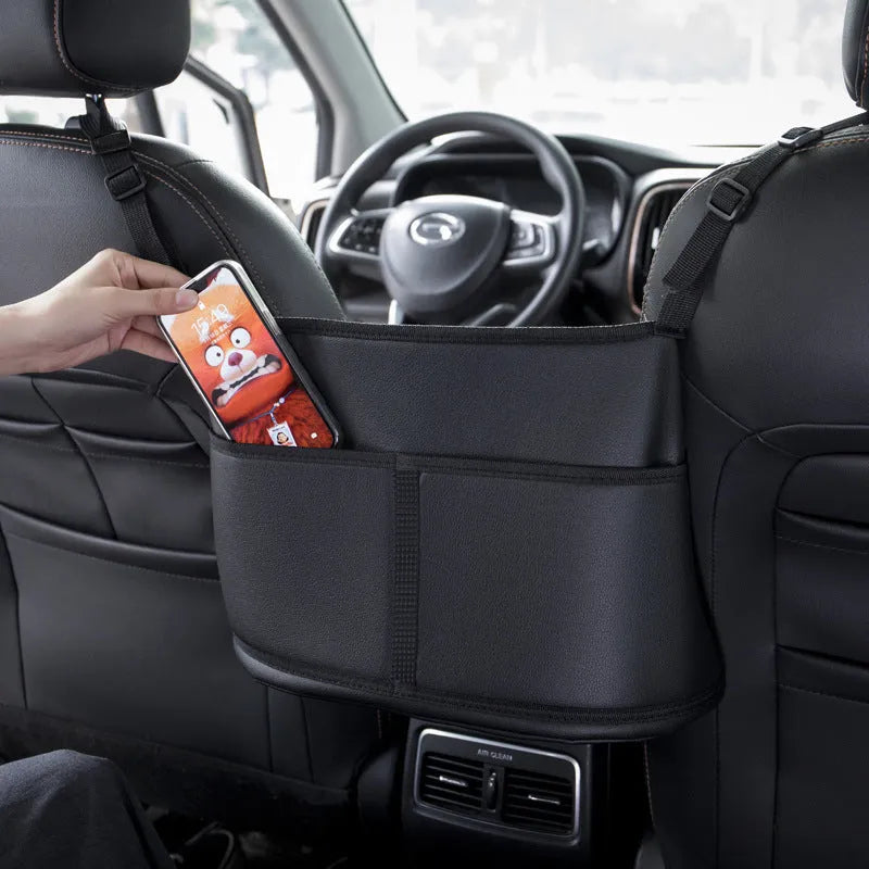 Black leather car seat storage bag with sports carbon fibre pattern measuring 38cm wide