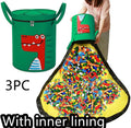 Green felt cube storage bag with pull rope that converts into a flat play mat for toys.
