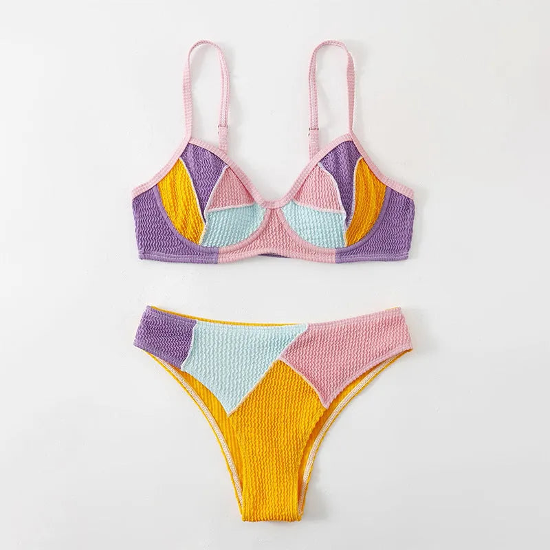 Ladies sleeveless push-up bikini set with steel bracket cups and crossover back stitching in a splicing colour pattern.