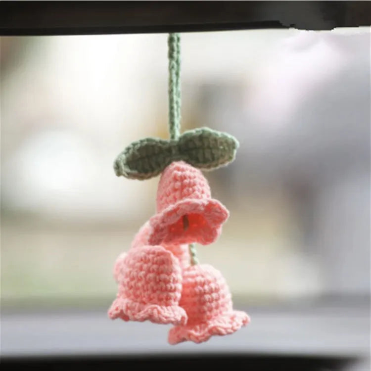 Green and white knitted wool car plant decoration with plastic base and hanging rope