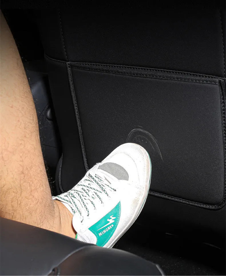 Pair of black leather anti kick pads for car seat backs, showing full coverage and single pocket.