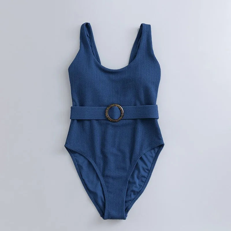Navy blue women's one-piece swimsuit with triangle design and chest padding on a mannequin.