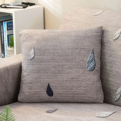 Printed geometric pattern sofa slipcover on a three-seater sofa in modern style