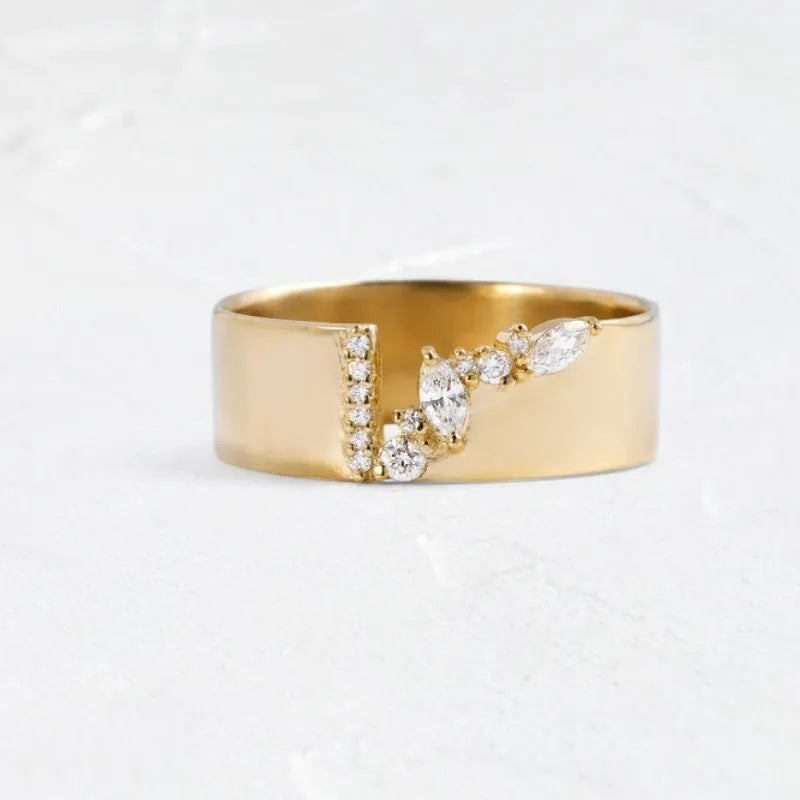 Gold electroplated copper ring for women with shining zircon accents, shown on a finger.