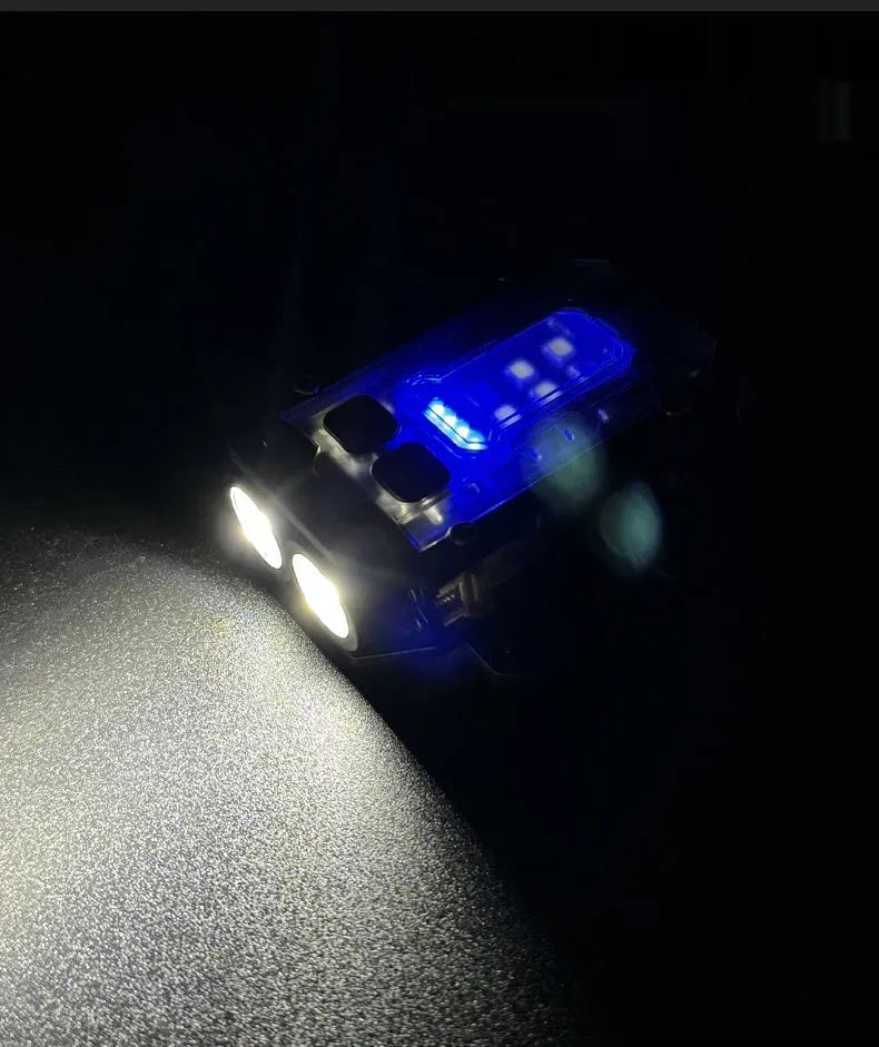 Compact USB rechargeable tactical flashlight with a black mounting clip attached to a backpack strap.