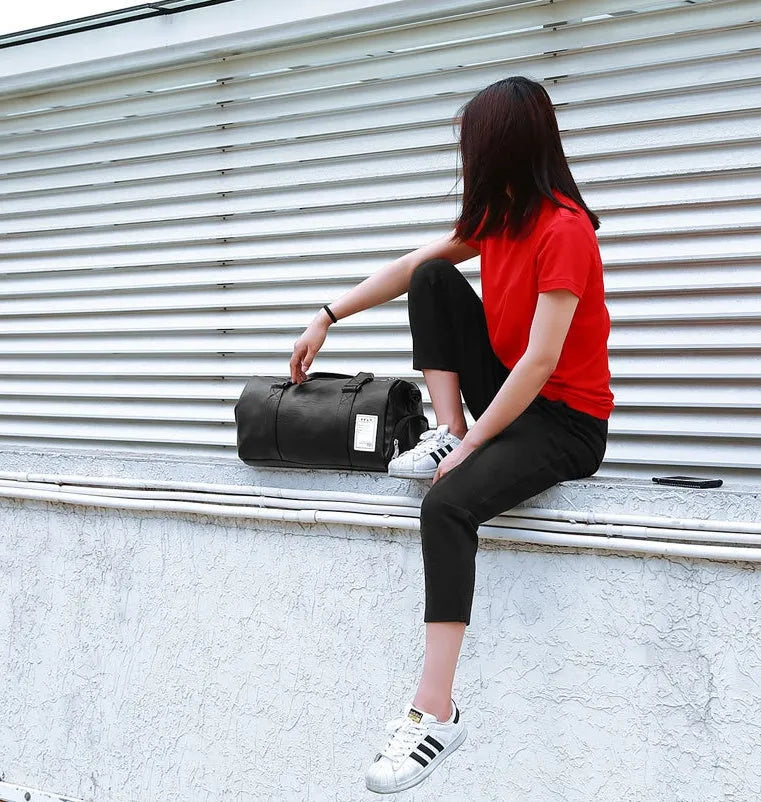 Black unisex waterproof sports gym bag with a separate shoe compartment shown in two size options.