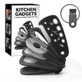 Six stackable kitchen gadgets including peelers, a brush, and tongs in a colour box.