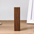Brown walnut wood portable power bank with USB port showing compact rectangular design.