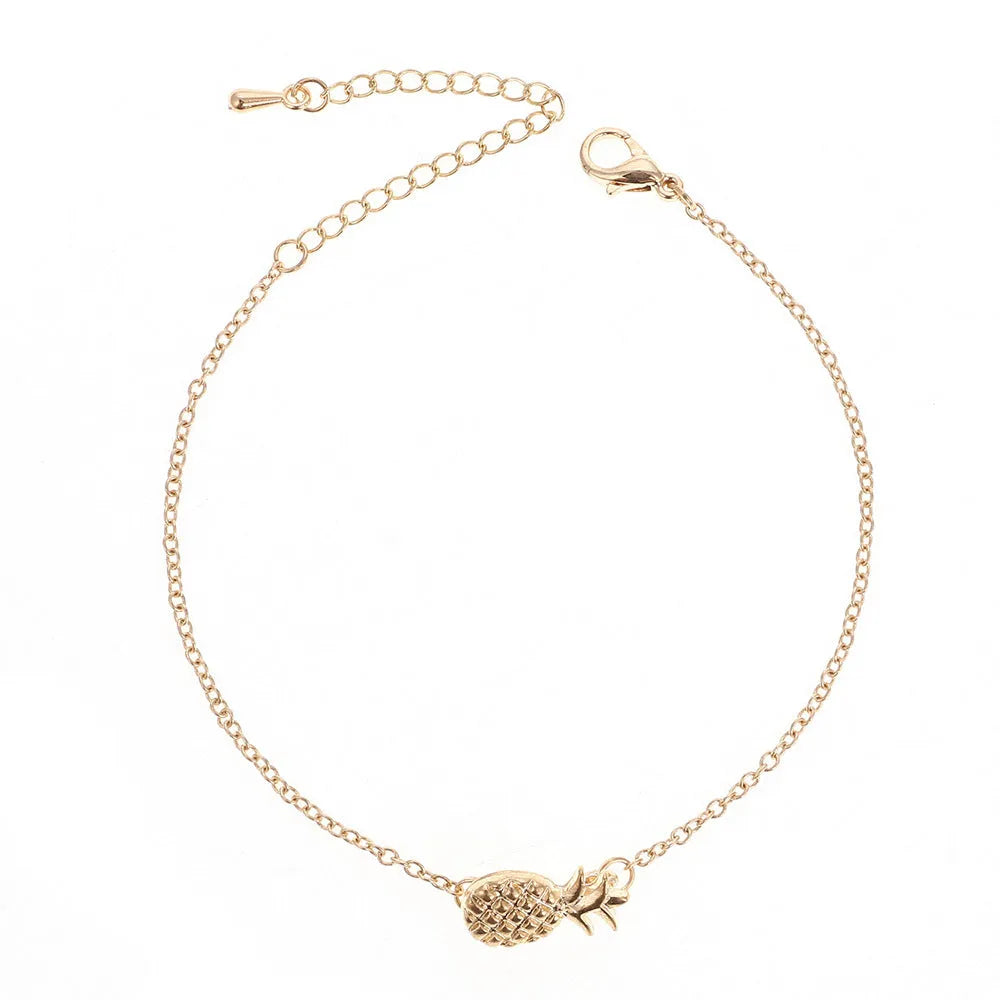 Gold or silver alloy bracelet with a simple pineapple charm pendant.