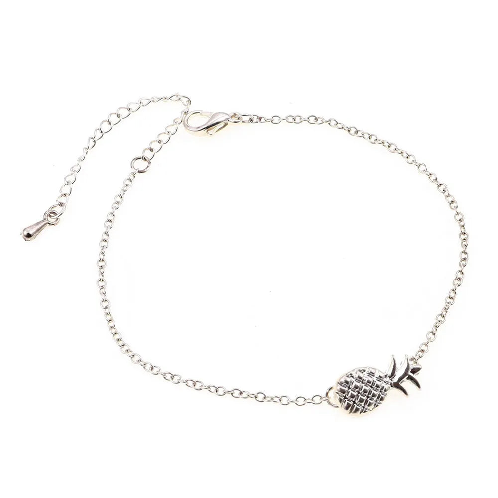 Gold or silver alloy bracelet with a simple pineapple charm pendant.