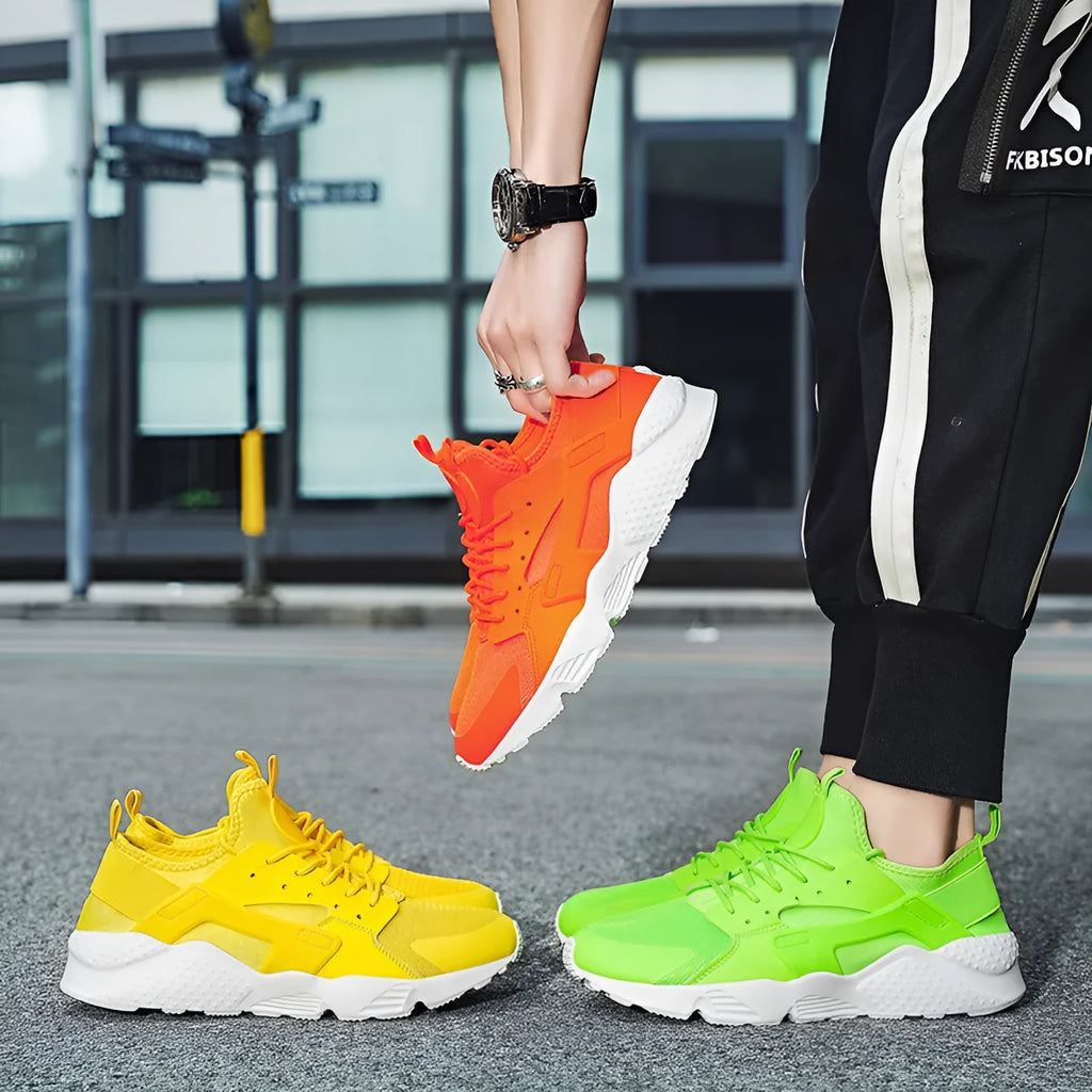 Men's low top casual shoes with mesh upper, cross shoulder straps, and round toe in fluorescent colour options