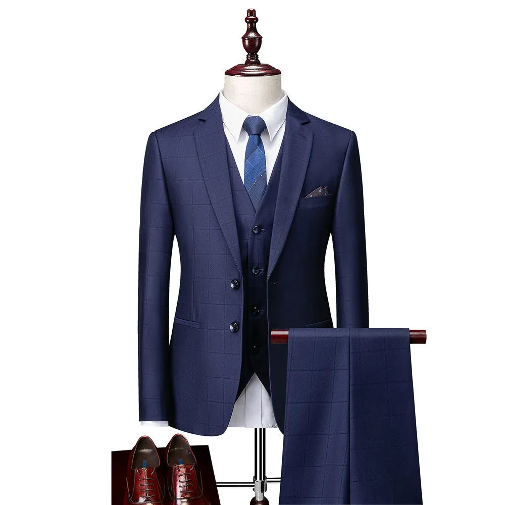 Men's navy blue slim fit plaid three-piece suit with jacket, vest, and trousers on a hanger.