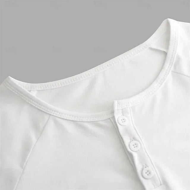 Men's white long-sleeved t-shirt with a Henry collar, laying flat.