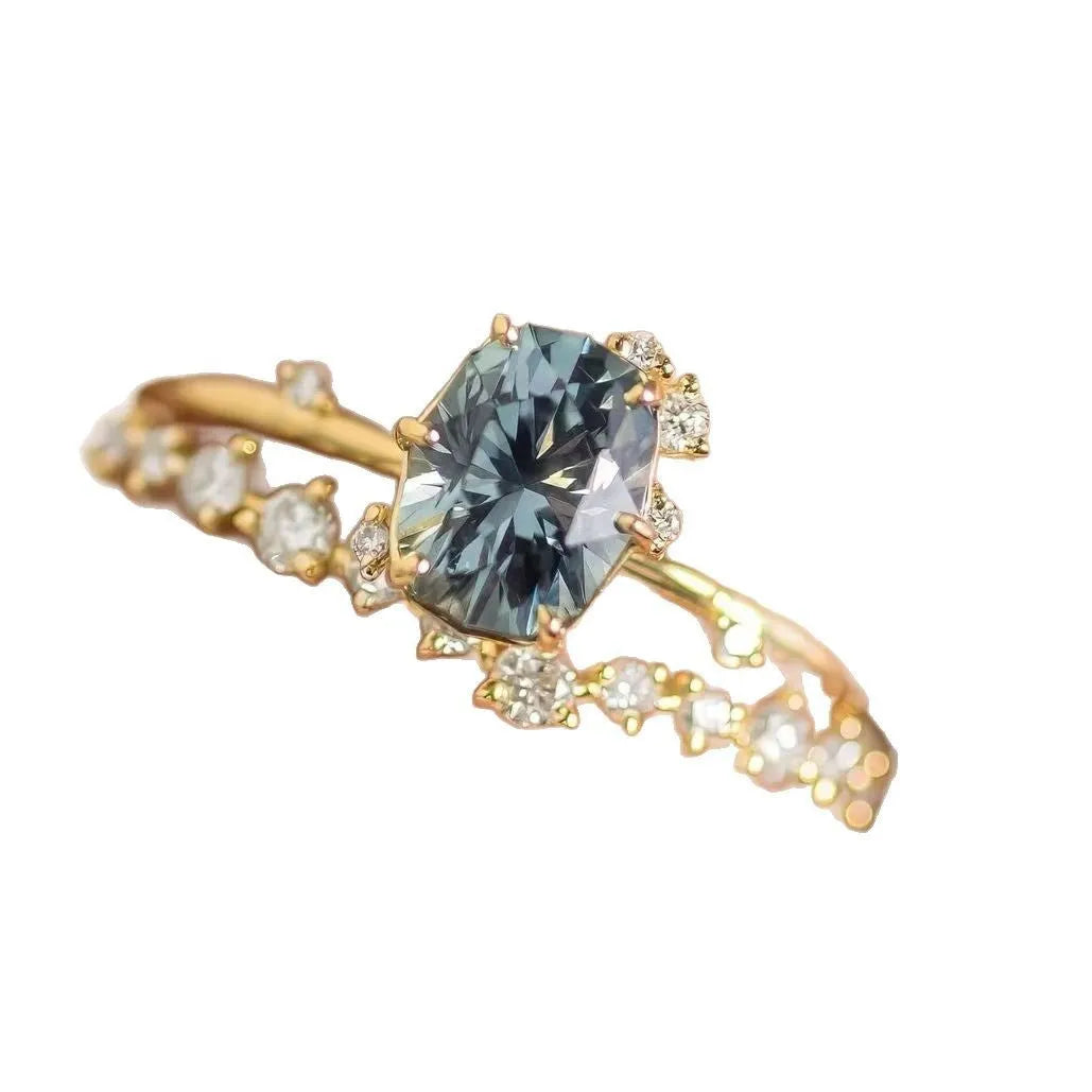 Gold plated women's ring with green zircon flower design on alloy band
