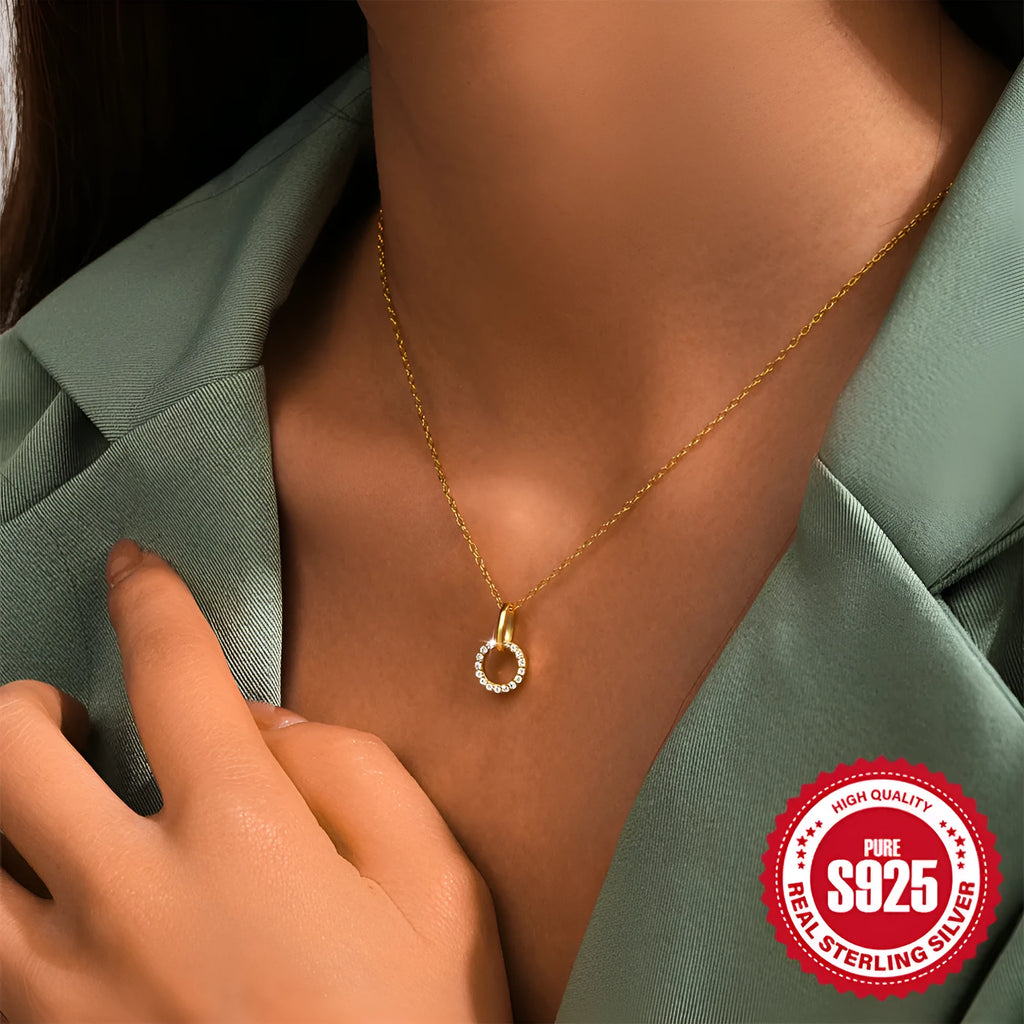 Gold-coloured S925 sterling silver clavicle chain with an interlocking geometric zircon pendant.