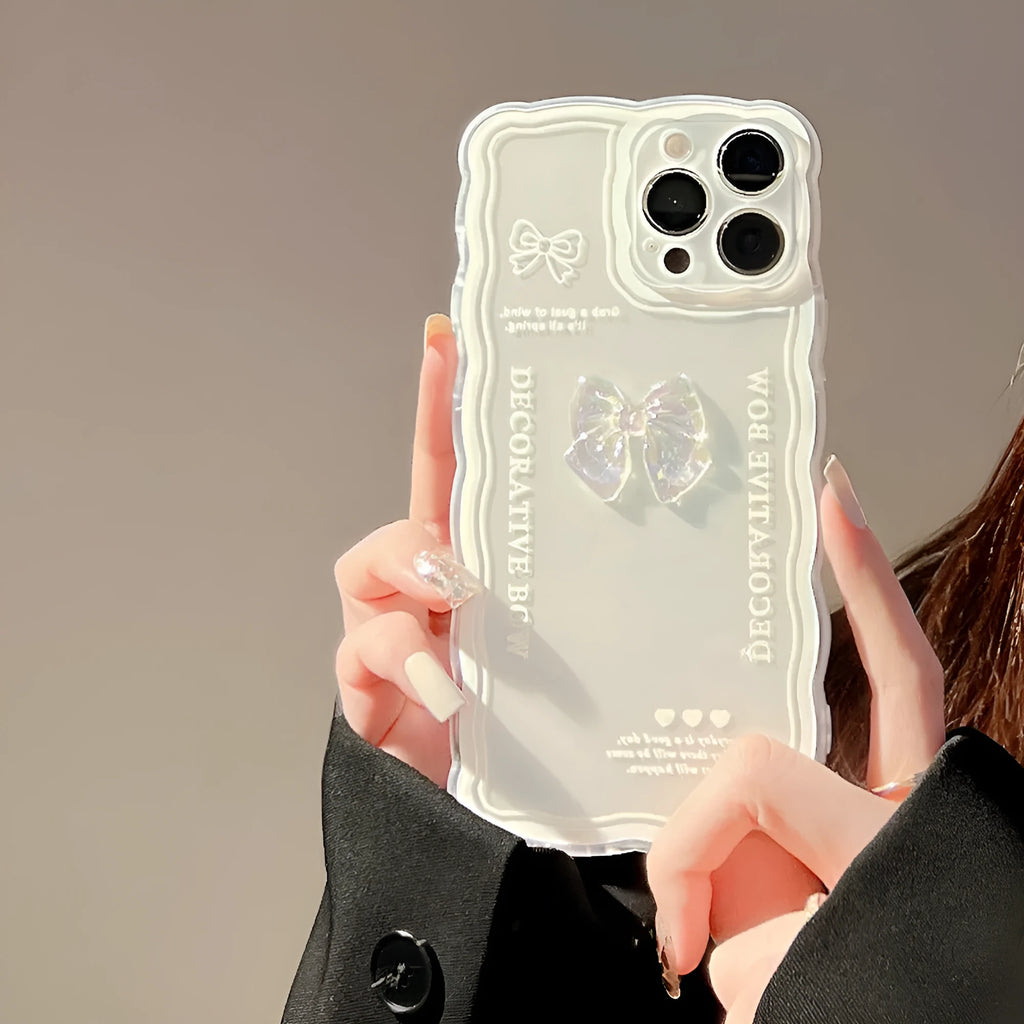 Transparent iPhone case with a raised 3D ice-through bow on a white background.