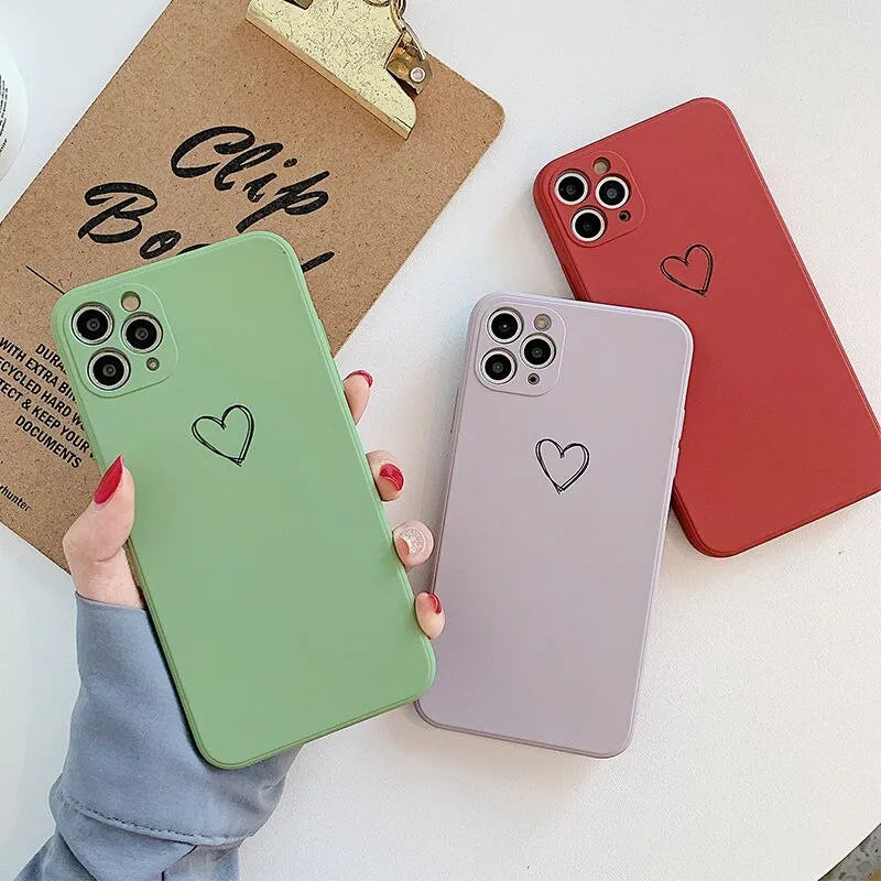 Solid colour TPU phone case for Apple iPhone in black, pink, and green showing precise cut-outs