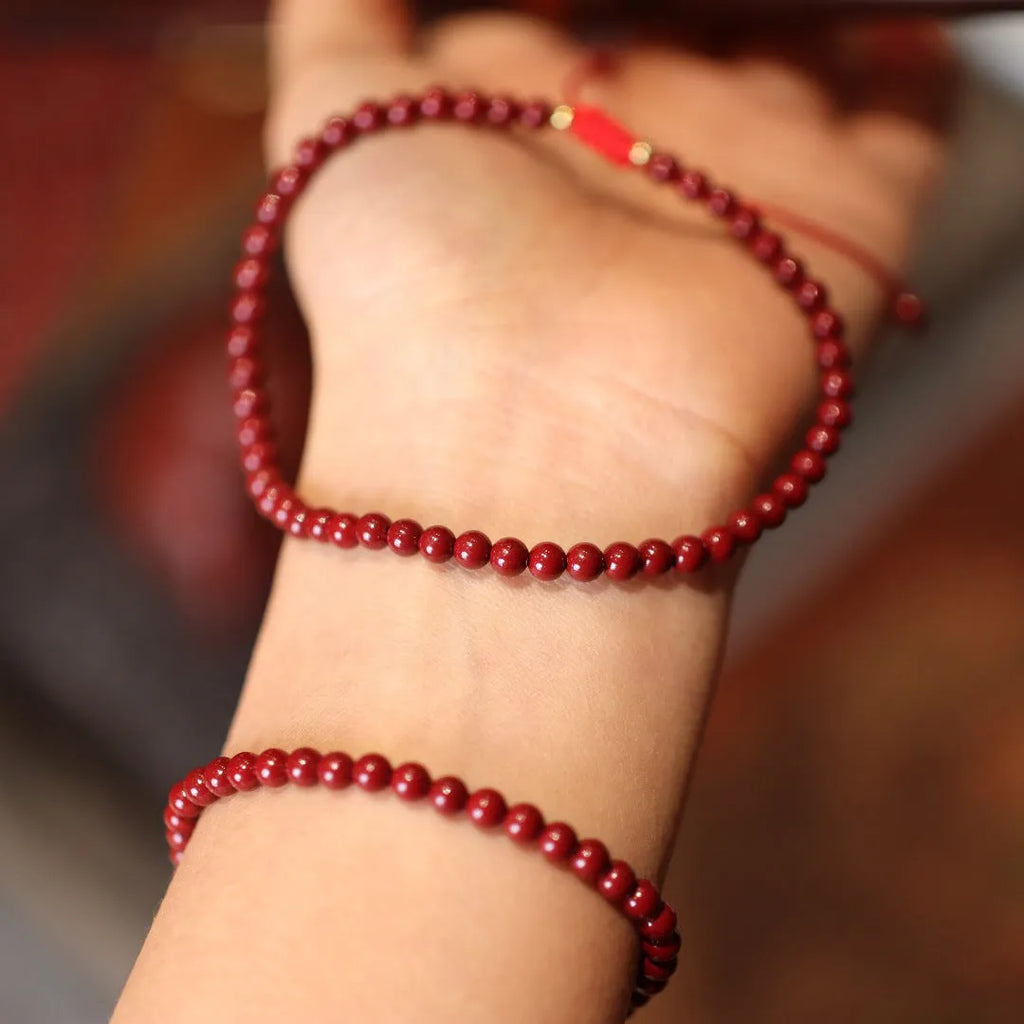Close-up of a purple gold sand design cinnabar bracelet with geometric Chinese patterns.