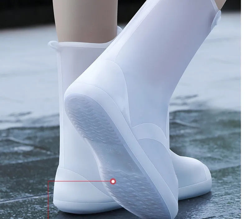 White PVC high top reusable water resistant shoe covers shown on a shoe.