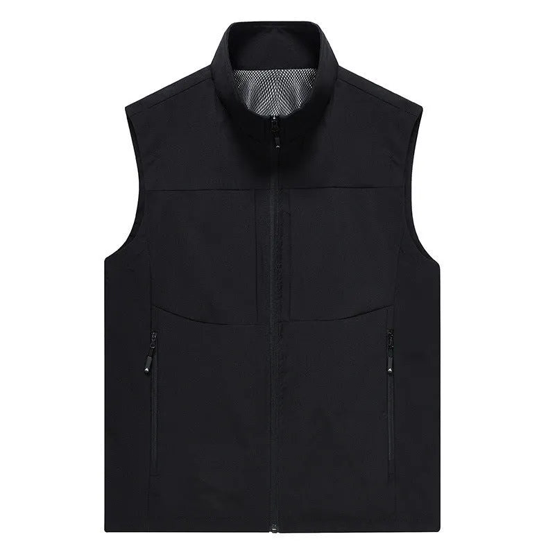 Man wearing a khaki stand collar cardigan vest with zipper pockets outdoors.