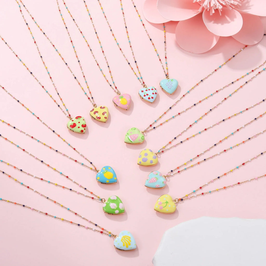 Gold-plated stainless steel necklace with heart-shaped fruit pendant on adjustable chain