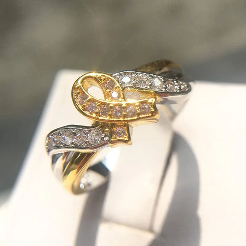 18k yellow gold plated ribbon ring with pink diamond inlay, US sizes 5 to 11, individual packaging