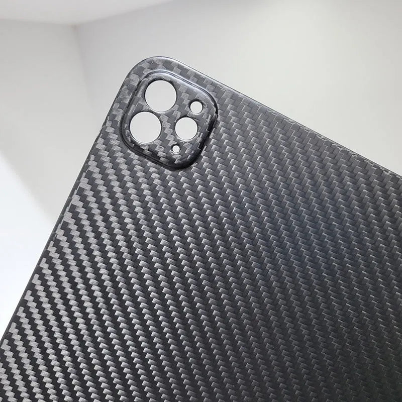 Carbon fibre hard case for Apple iPad Pro 11 showing embossed plaid pattern and matte finish.