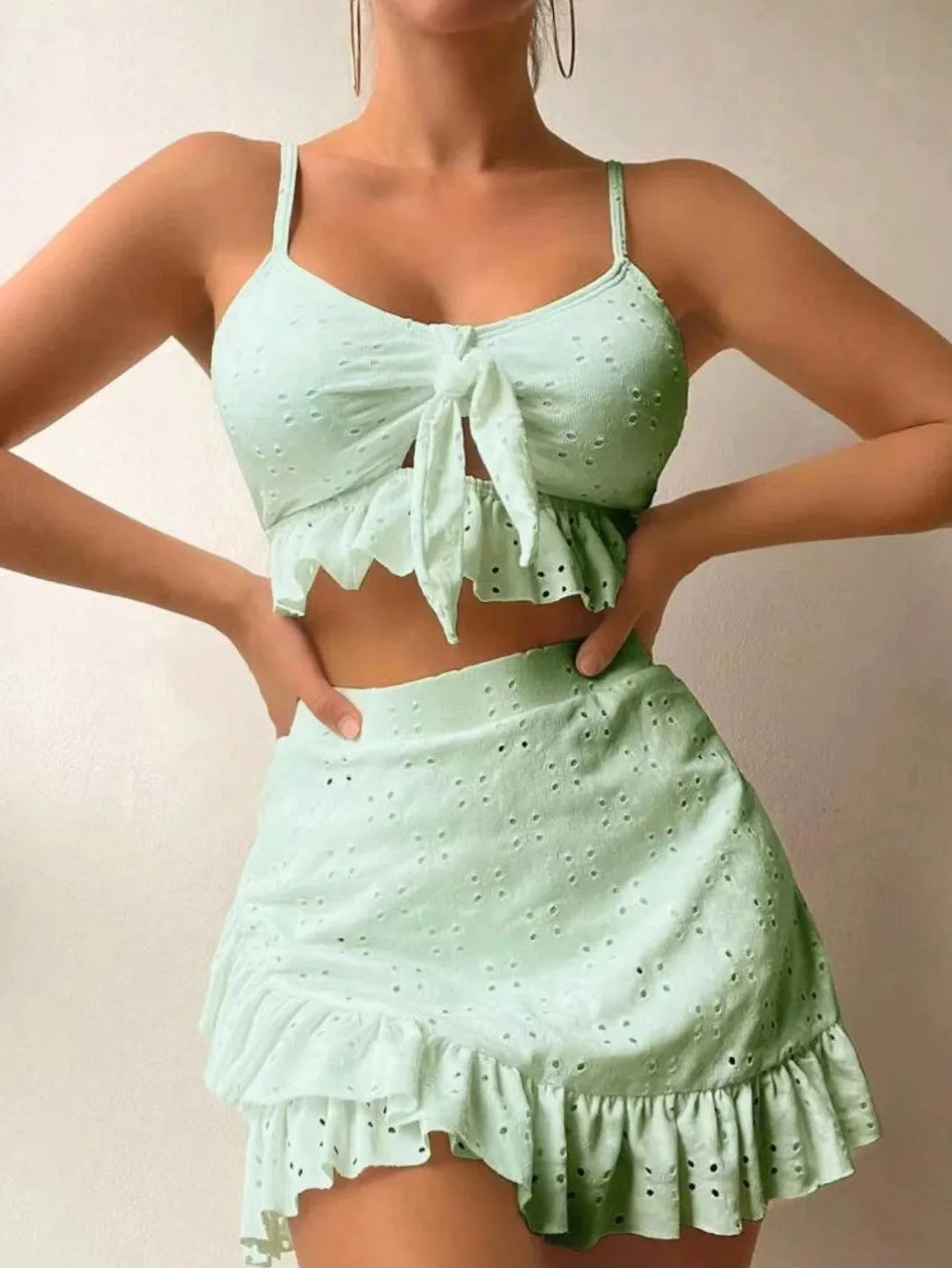 Women's three-piece bikini swimsuit with split hip skirt in solid colour options