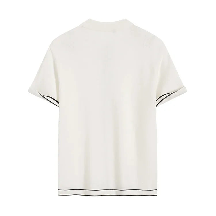 White women's short sleeve cardigan with dark contrast lapels on the collar.