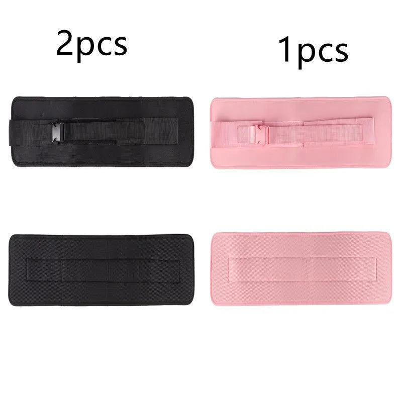 Black fitness training belt with dumbbell strap for hip bridge exercises