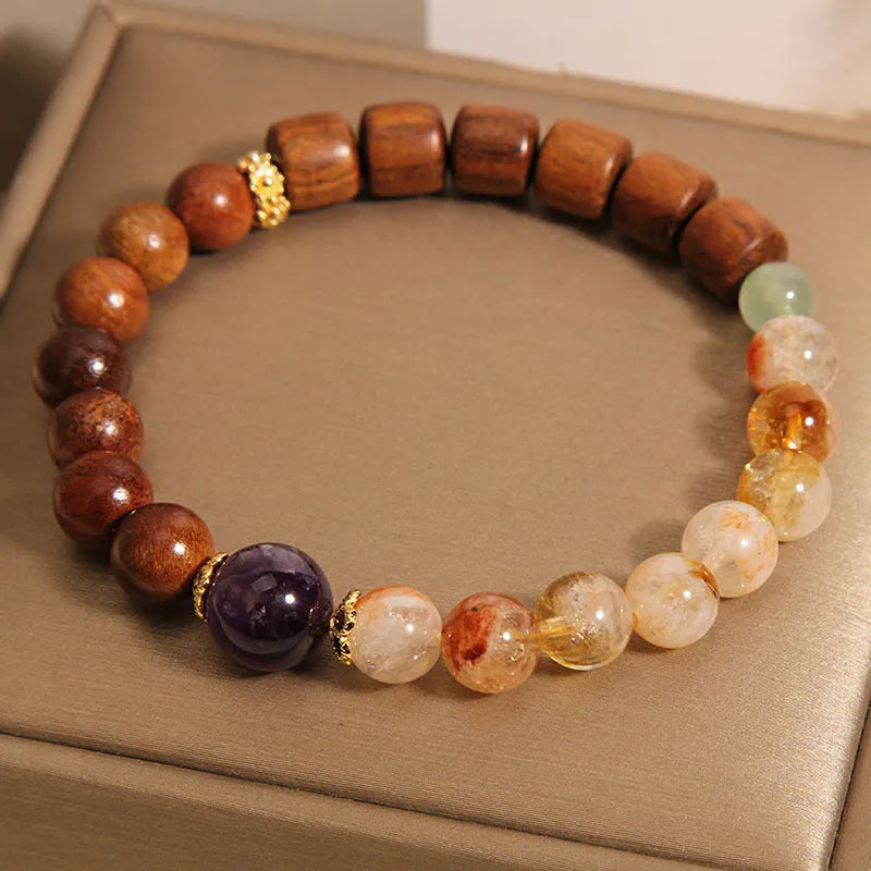 Women's pineapple yellow bracelet with yellow tower crystal, ebony amethyst beads, and pearl accents