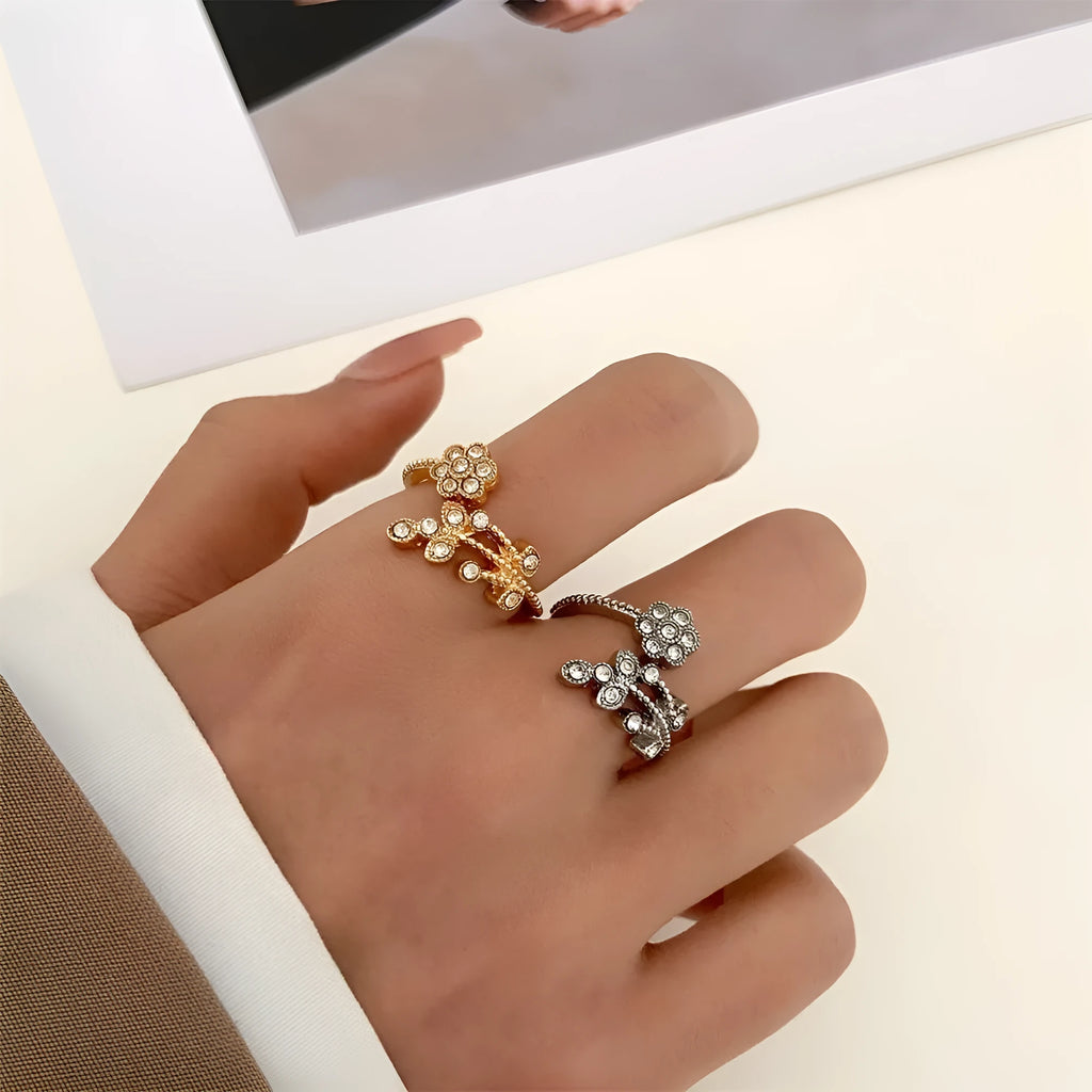 Women's open ring with diamond-treated flower and leaf design in gold colour on copper base