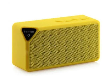 Cannon X3 mini cube-shaped wireless Bluetooth speaker in one of five colours: black, blue, green, red, or yellow.