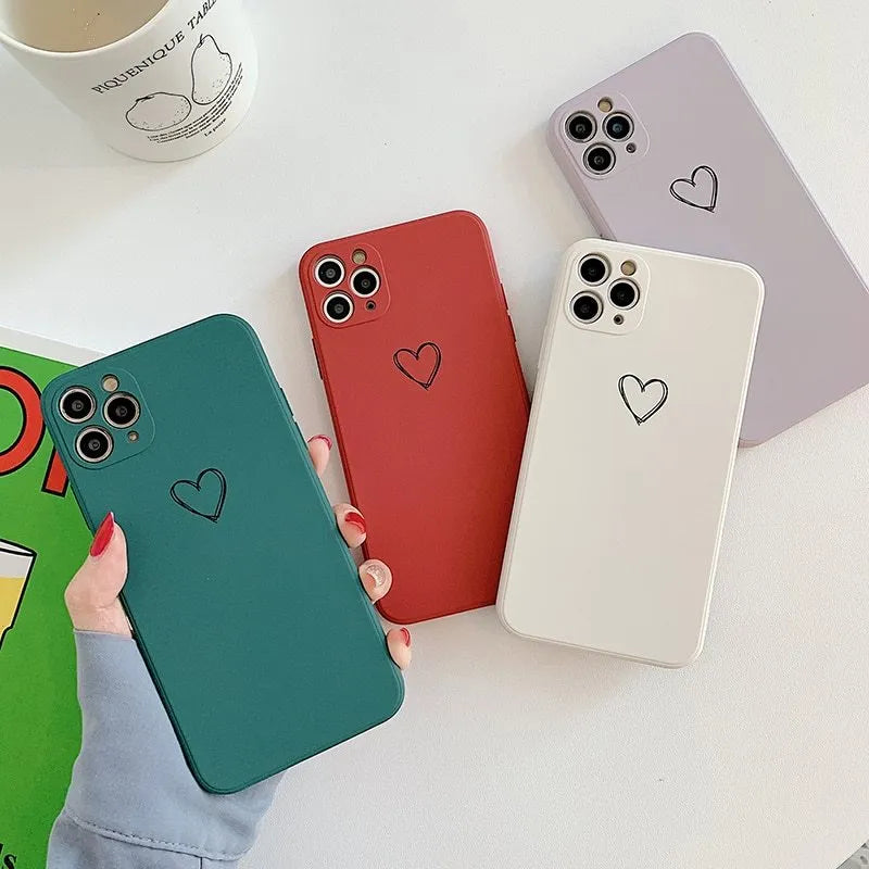 Solid colour TPU phone case for Apple iPhone in black, pink, and green showing precise cut-outs