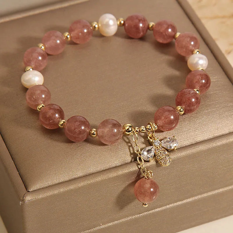 Women's bracelet with freshwater pearls and strawberry quartz stones with zircon accents on alloy hardware
