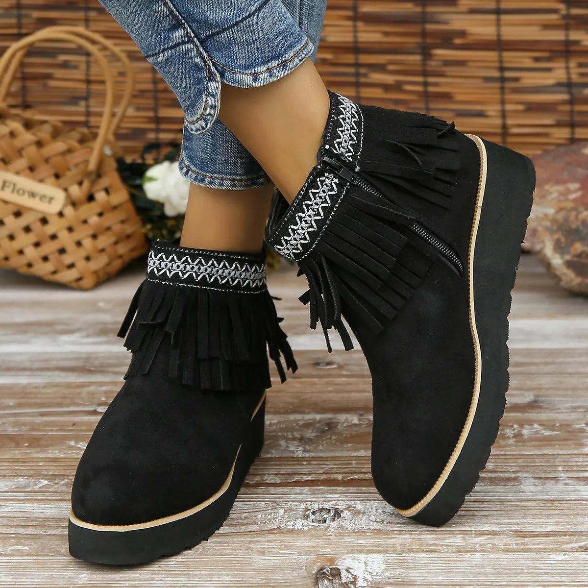 Women's dark brown suede ankle boots with thick platform wedge sole, side zip, and tassel detail.