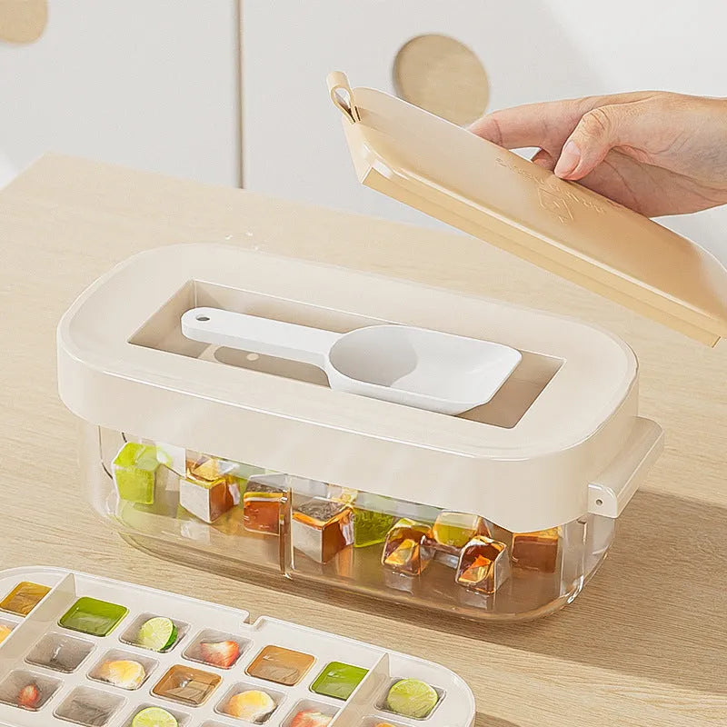 Yellow high-capacity plastic ice cube tray with leverage design and integrated shovel storage slot