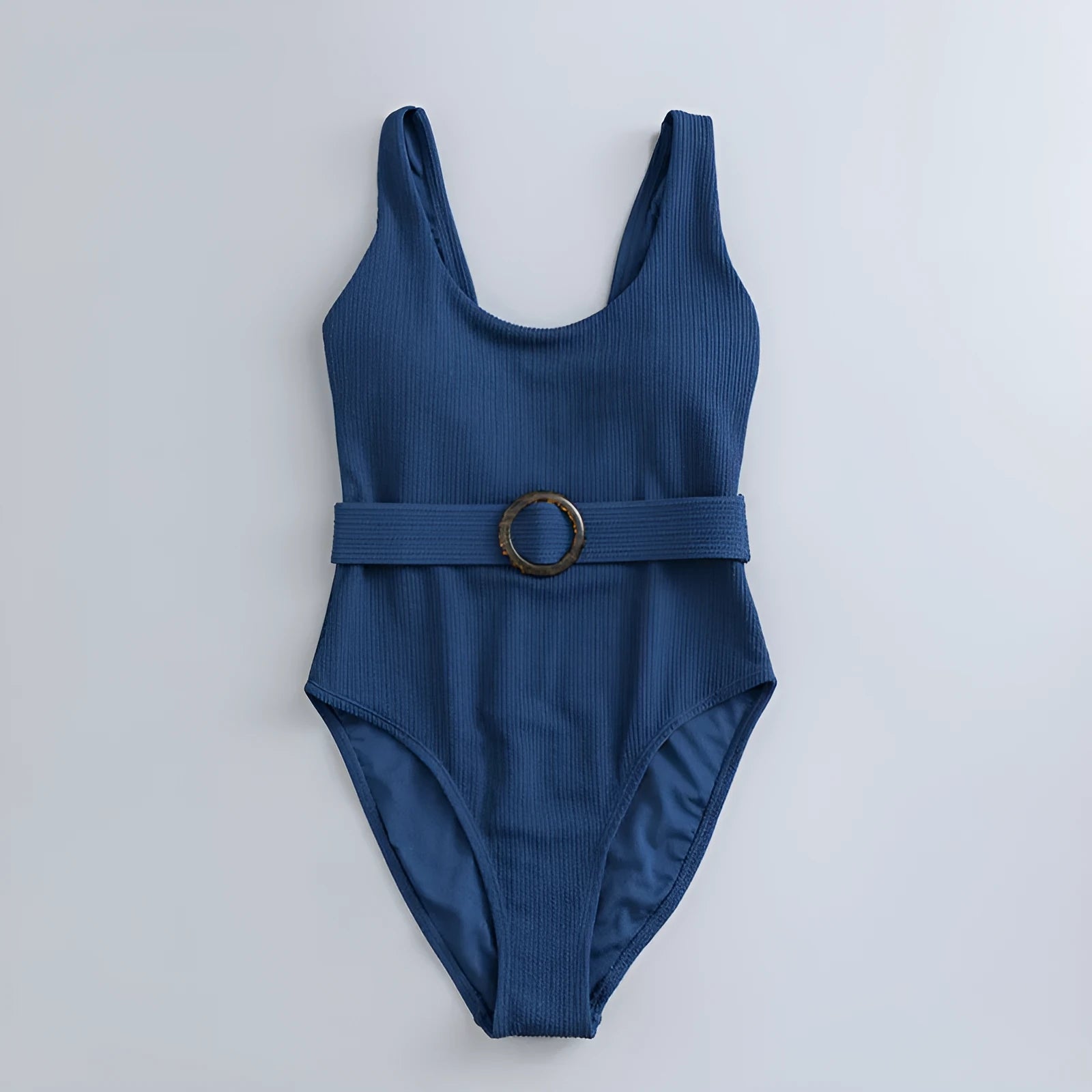 Navy blue women's one-piece swimsuit with triangle design and chest padding on a mannequin.
