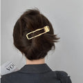 Gold and silver zinc alloy hair barrettes showing arc, square, and triangle shapes on a white background.