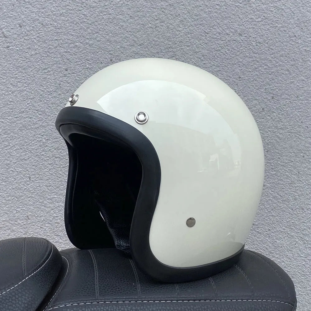 Retro-style half-shell motorcycle helmet in fibreglass, shown in a cement grey colour option.