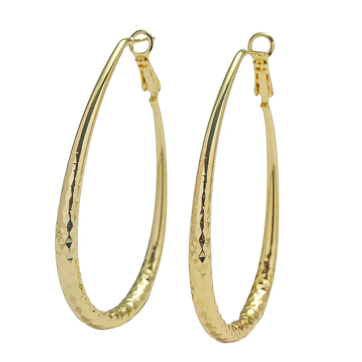 Gold egg-shaped copper earrings with hypoallergenic posts and spring fasteners, unisex geometric ellipse design