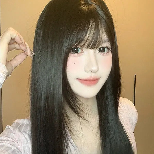 Dark brown full-head wig with long straight hair and bangs on display stand