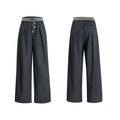 Drooping straight-leg trousers with button open line design in black and grey colours