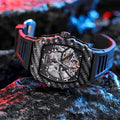 Men's mechanical wristwatch with luminous markers on a rubber strap, showing a see-through case back.