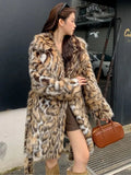 Long faux fur coat with fox print design, fur collar, and pockets in a street fashion style.