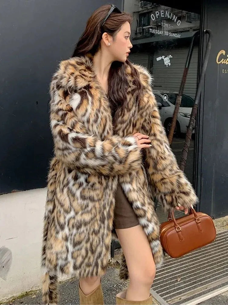Long faux fur coat with fox print design, fur collar, and pockets in a street fashion style.